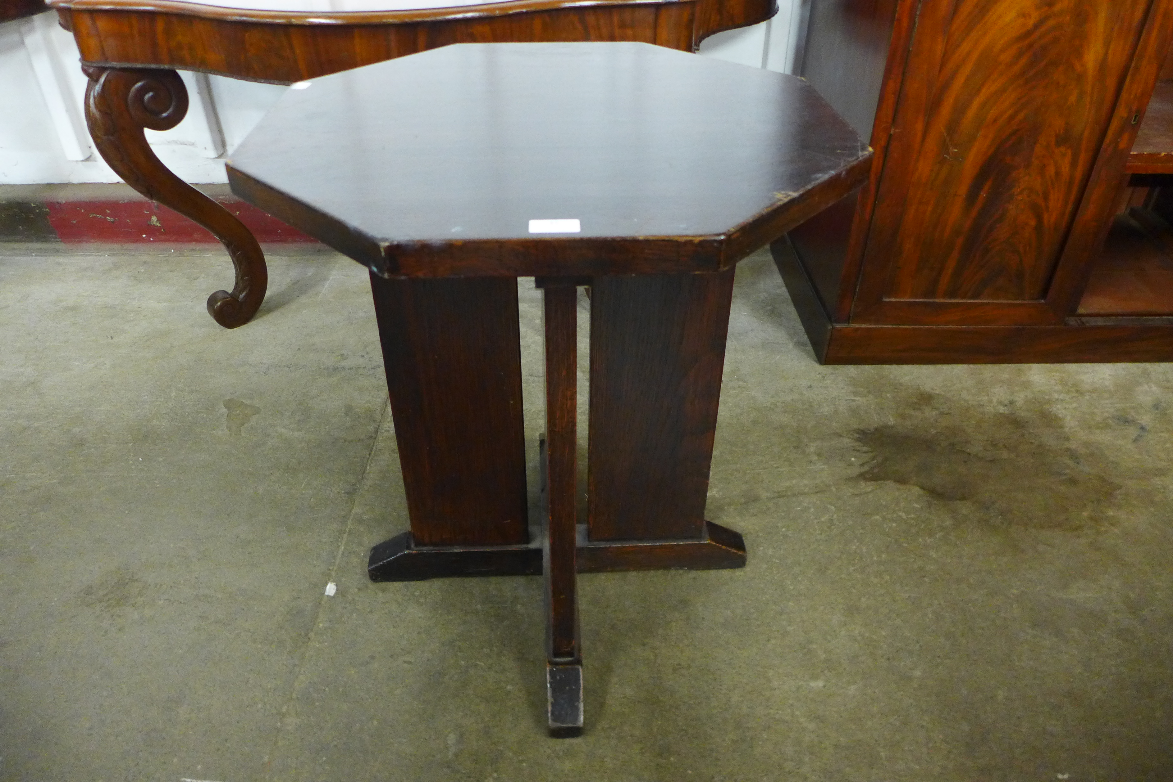 An Arts and Crafts oak octagonal occasional table