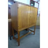 A Danish teak two door side cabinet