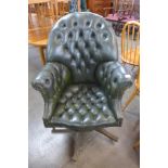 A green buttoned leather revolving desk chair