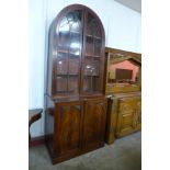 A George IV mahogany dome top bookcase, 248cms h, 100cms w, 53cms d