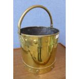 An Arts and Crafts brass coal bucket