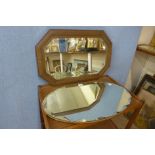 A carved oak octagonal framed mirror and another mirror