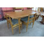 A Mcintosh teak extending dining table and four chairs