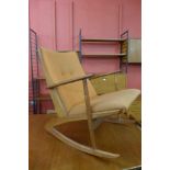 A Danish Kubus Boomerang teak and orange fabric rocking chair, model no. 97, designed by Georg