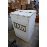 A painted metal flour bin