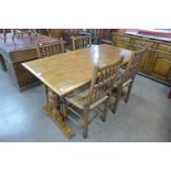 An oak refectory table and four chairs