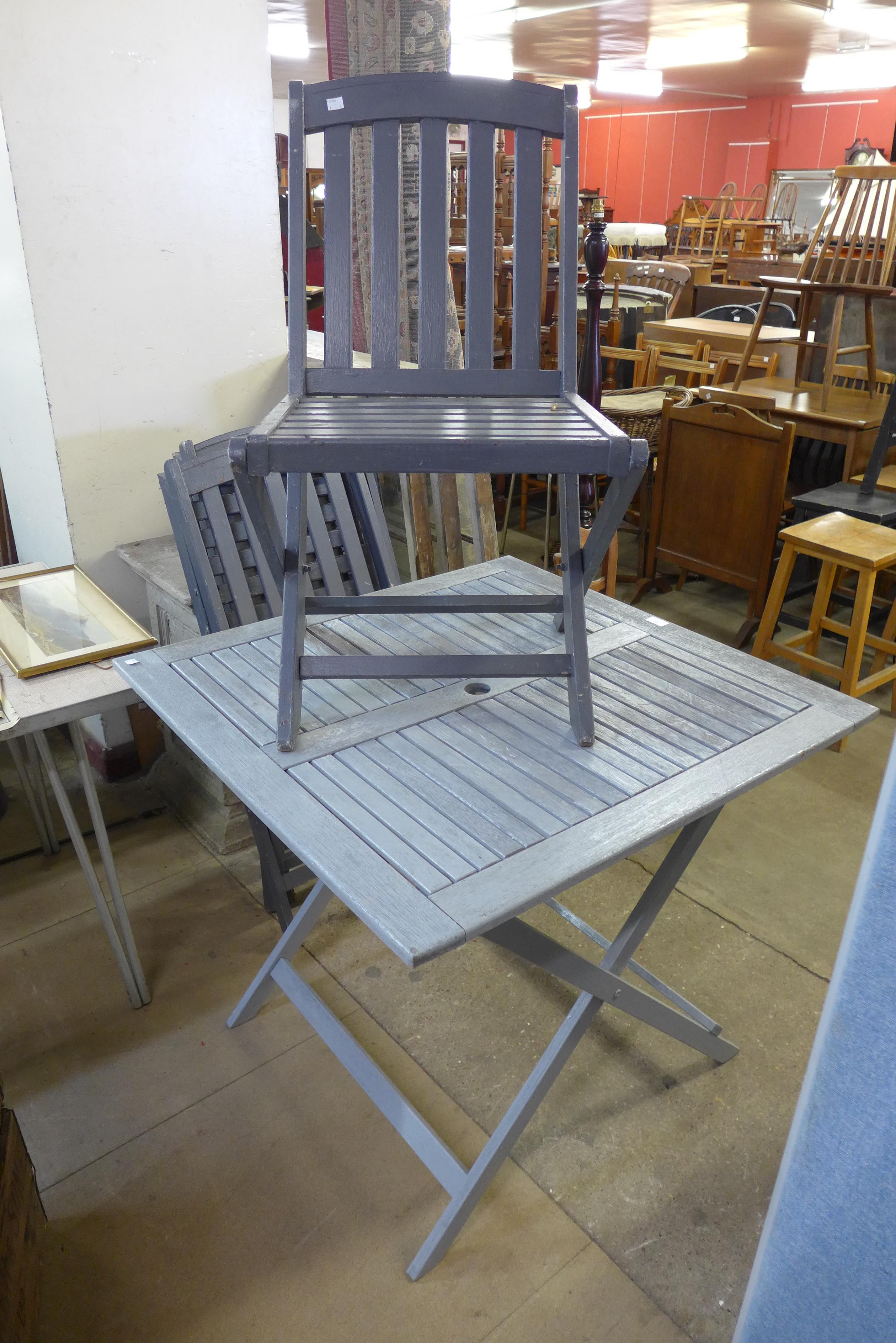 A painted garden table and three chairs