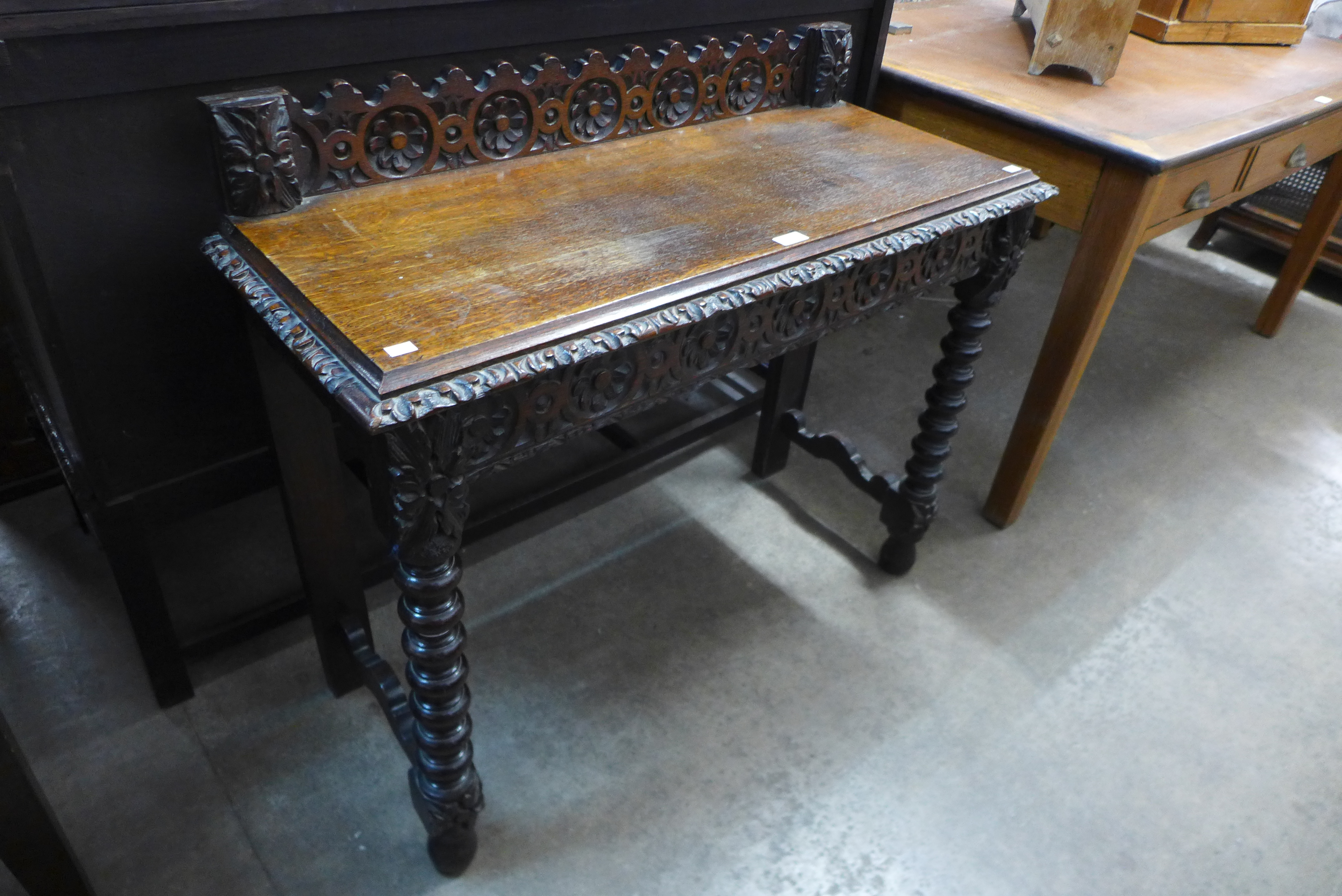 A Victorian Jacobean Revival carved oak hall table