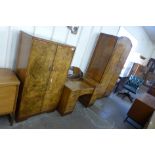 An Art Deco figured walnut three piece bedroom suite