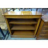 A yew wood open bookcase