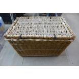 A large wicker picnic basket