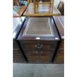 A mahogany and leather topped filing cabinet