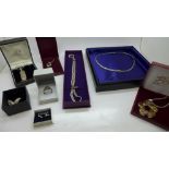 Five silver pendants and chains, silver brooches, charms, etc.