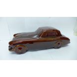 A model classic car in brown glaze