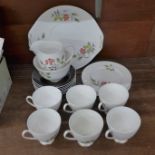 A 1950's Queen Anne Kansas bone china tea set, six setting with cream, sugar and sandwich plate