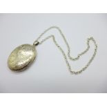A large silver locket and chain, width 37mm