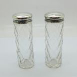 Two silver topped glass bottles, 8.5cm