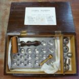 A Christy Cachet Machine, pill maker, with box