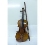 A violin with case and bow, with paper label marked Skylark brand, made in Canton, length of back