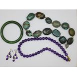 A turquoise bracelet, an amethyst necklace and earrings and a jade bangle