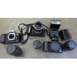 Three cameras, Nikon Minolta and Canon; F401, 7000i and EOS 1000F with three lenses, Nikon 28mm,