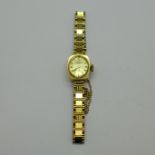 A lady's 9ct gold Tissot wristwatch on a 9ct gold bracelet strap, total weight with movement 15.5g