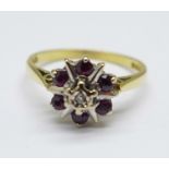 An 18ct gold, ruby and diamond cluster ring, 2.7g, M