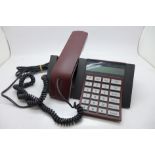 A Bang & Olufsen BeoCom 1600 telephone, with instructions