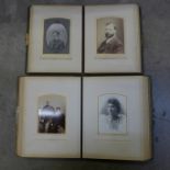 Two Victorian photograph albums with a collection of family photographs