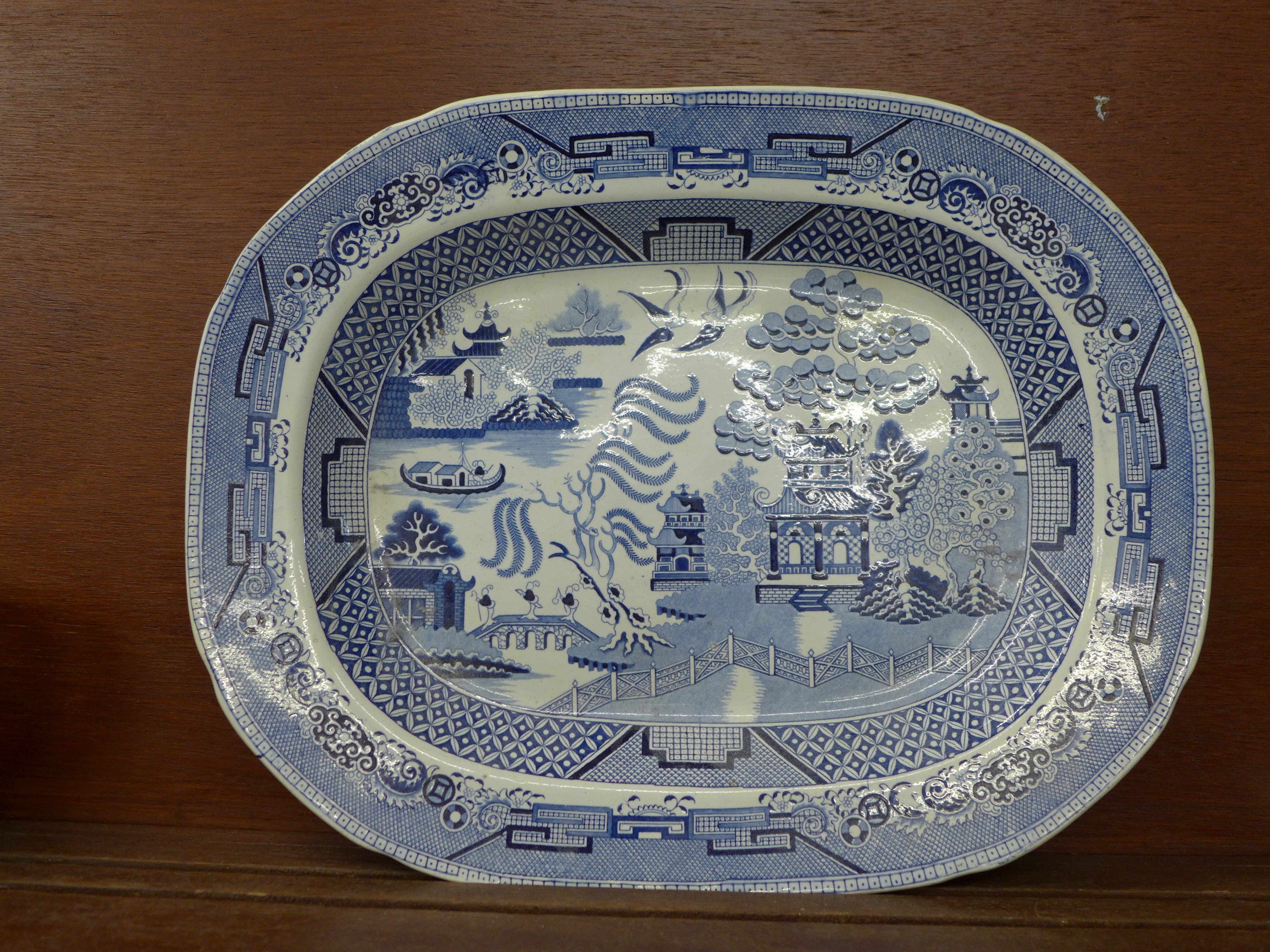 A Staffordshire blue and white Willow pattern serving plate