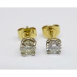A pair of diamond stud earrings, approximately 1carat total diamond weight, set in 18ct gold