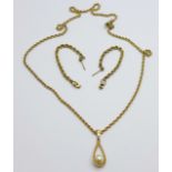 A 9ct gold rope chain with a yellow metal mounted pendant, and a pair of 9ct gold rope earrings,