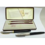 A cased Cross pen and pencil set and two Sheaffer fountain pens, one with 14k gold nib