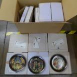 A collection of twelve Russian Legends plates including hanging shelf