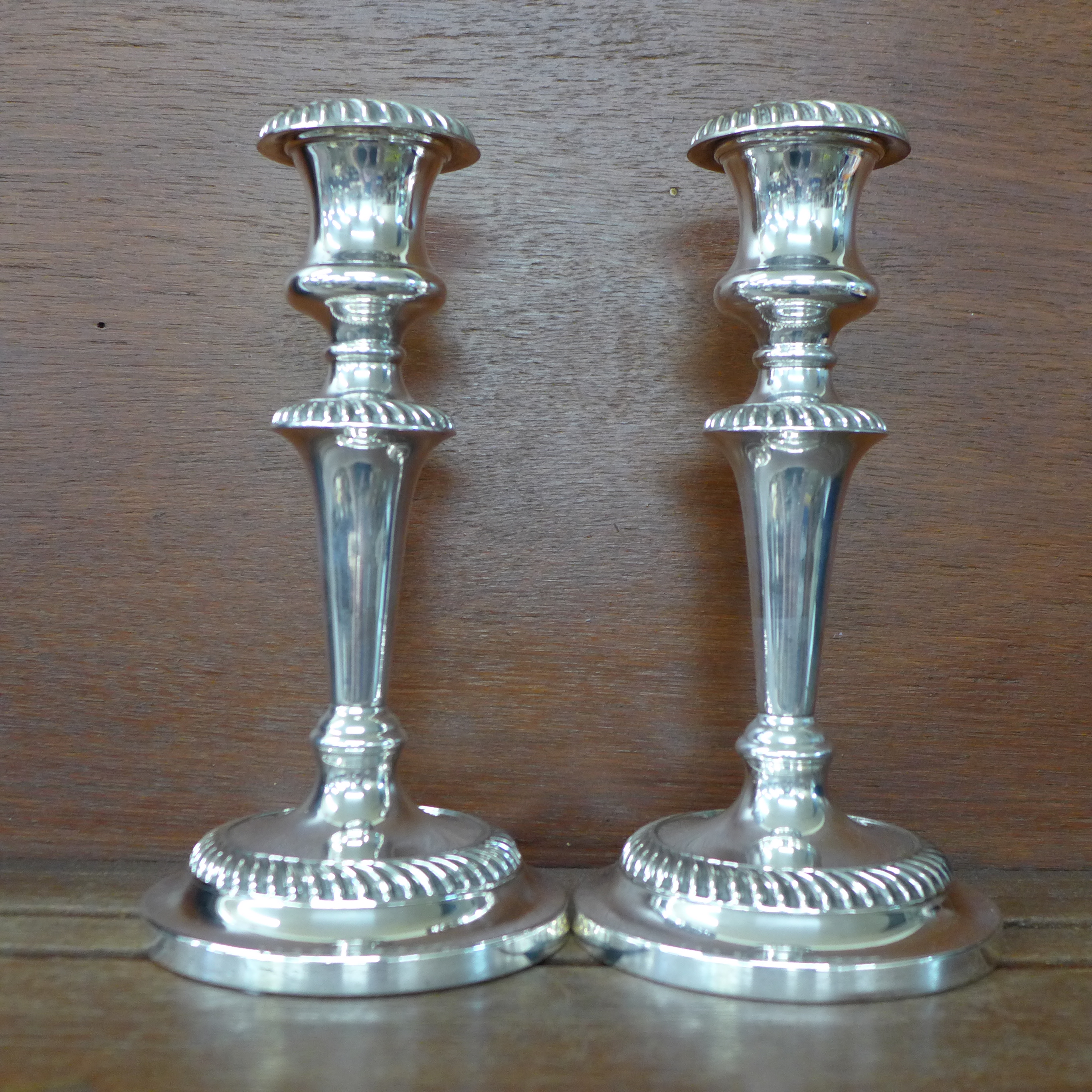 A pair of silver plate on copper candlesticks by William Suckling & Son, Birmingham, 21cm - Image 2 of 4