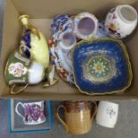 A Wedgwood cup, Coalport yellow ground and cobalt blue vase with finial, a Poole Pottery beaker