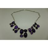 A silver and amethyst necklace