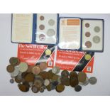 A collection of coins including two The New £1 Coin by Royal Mint, two Britains First Decimal