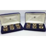 Two boxes of six silver napkin rings, 100g