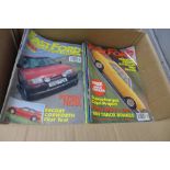 A box of car magazines, approximately 130, including Fast Ford, etc.