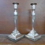 A pair of silver plated candlesticks, marked 'Patent K 1626', 28cm