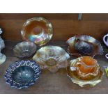 Nine pieces of carnival glass, including a blue example and a bowl decorated with horses