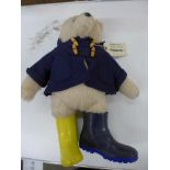 A Paddington Bear figure with odd boots