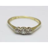 An 18ct gold, three stone diamond trilogy ring, 2.1g, P