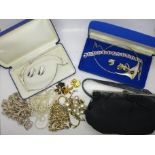 A hallmarked silver bracelet, costume jewellery and an evening bag