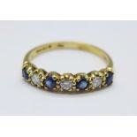 An 18ct gold, seven stone sapphire and diamond ring, 2.6g, Q