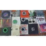 A box of approximately forty 7" vinyl singles, all 1980's including Specials, The Jam, Cocteau