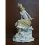 A Lladro Girl at the Seaside/Pond figure, model no. 4918, year issued 1974, retired 1985, sculptor