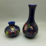 A Moorcroft Columbine squat vase, 7cm, and one other Moorcroft blue ground vase, 16cm