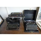 A vintage Remington typewriter and one other